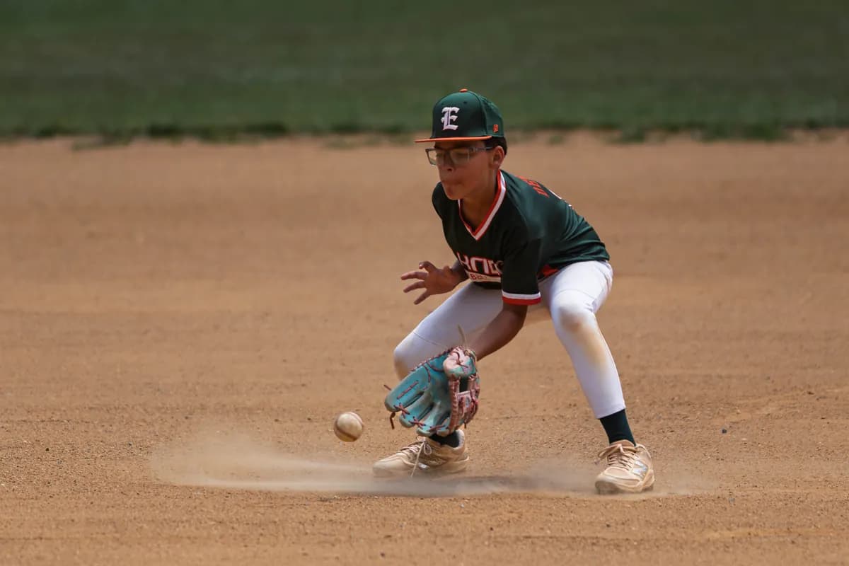 A Hurricanes infielder charging a ground ball