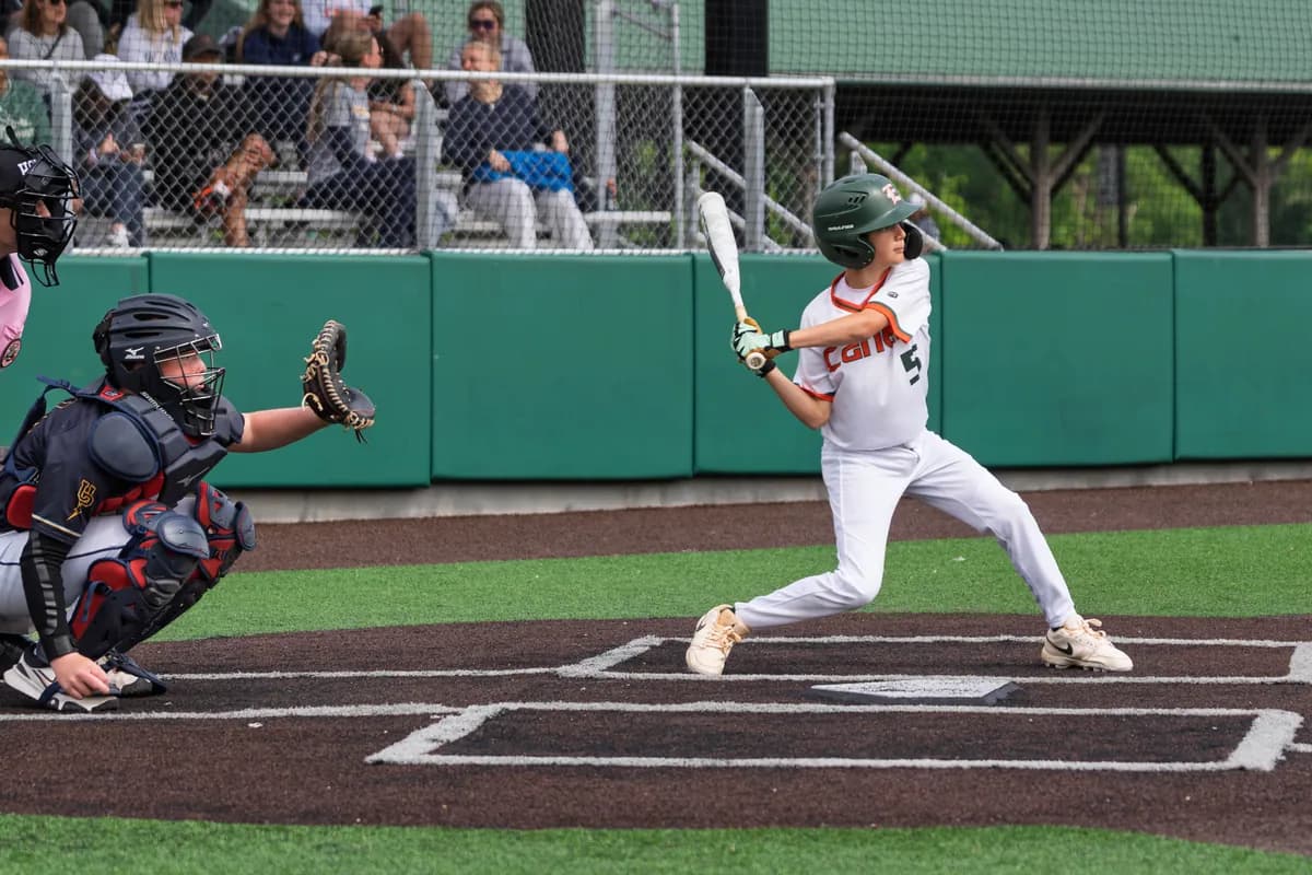 A Hurricanes batter mid-swing